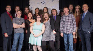 Students learn to deliver on 21st century platforms - UW-River Falls “Paper Trail” cast and crew group photo at premiere screening event. December 2016.